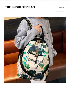 Detail view of a stylish floral print Oxford cloth small backpack, casual dual-use travel bag.