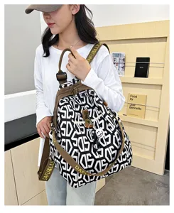 Fashionable geometric oxford cloth backpack for women, casual commuting travel school bag.