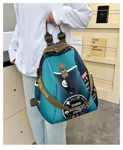Gradient nylon canvas casual backpack detail view with straps and stylish badge decoration