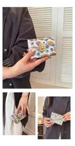 Cute printed PU leather card holder, short folding coin purse with sunflower and bee pattern.