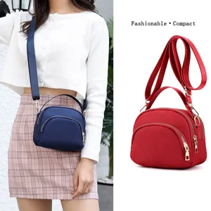 Mini nylon shell crossbody bag detail view, lightweight compact design for daily commute.