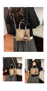 Detailed view of the stylish leather bucket bag showcasing its soft texture and cute bear pendant.