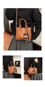 Closeup details of the stylish brown bucket bag featuring cute bear charm and soft leather material.