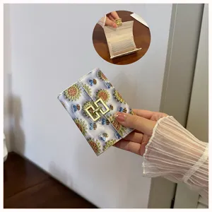Cute PU leather card holder detail showing interior multi-card slots and sunflower print design.