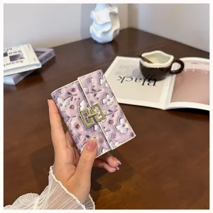 Purple floral PU leather card holder for women, short trifold multi-card wallet with chic lock.
