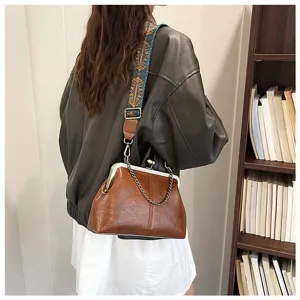 Detailed view of vintage PU leather shell shoulder bag featuring chic metal chain and strap.