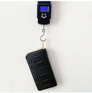 Black quilted long zip wallet with large capacity and multi-card slots for daily use.