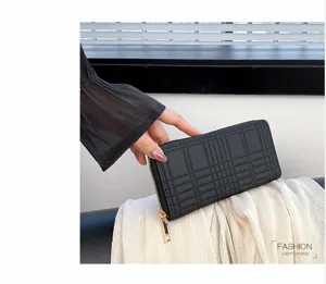 Close-up view of a black quilted long zipper wallet with multiple card slots and elegant design.