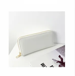 Monedero largo minimalista blanco para mujer con cremallera dorada, elegante bolso casual.