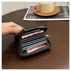 Portafoglio porta carte nero compatto in ecopelle con zip e scomparti per donna elegante.