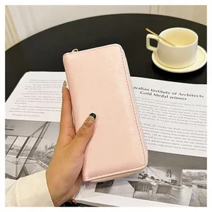 Portafoglio lungo rosa con cerniera da donna, elegante pochette con scomparti per carte.