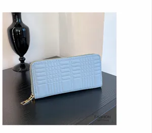 Light blue long zipper wallet with plaid embossing, multiple card slots for women.