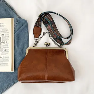 Retro PU leather kiss-lock shell shoulder bag with chain strap and vintage pattern strap