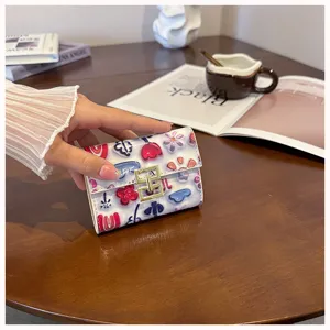 Cute printed PU leather short wallet for women, multi-card slot folding coin purse.