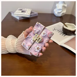 Cute floral PU leather card holder, stylish folding mini wallet detail view with metal clasp.