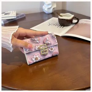 Detailed view of the cute printed PU leather card holder showcasing fine texture and snap closure.
