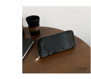 Black snake pattern long wallet for women, stylish faux leather zip around clutch purse.