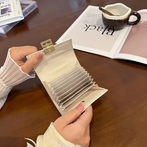 Cute PU leather card holder for women, short multi-card slot folding accordion wallet design.