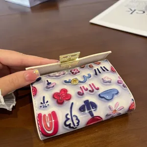 Cute printed PU leather short folding card holder wallet for women with colorful floral design.