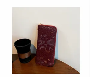 Snake pattern long wallet detail view, premium pu leather design with zipper closure.