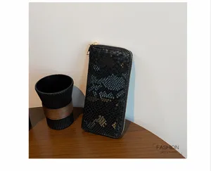 Elegant black snake pattern long zip wallet for women, large capacity clutch purse with card slots.