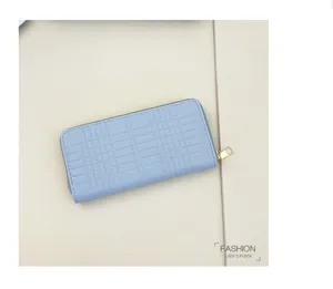 Light blue long zipper wallet with embossed grid pattern and multiple card slots for women