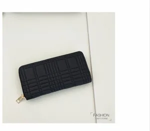 Black quilted long zipped wallet with card slots and elegant plaid pattern design.