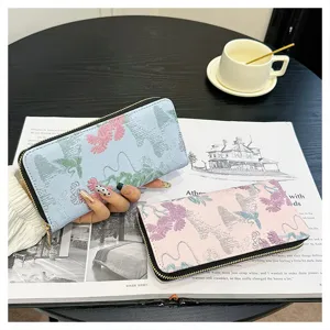 Portefeuille long pour femme avec fermeture éclair et broderie florale, grand porte-cartes chic.