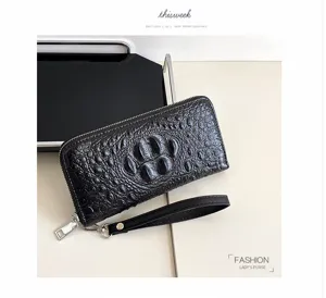 Portefeuille long noir texture crocodile avec lanière, grand format zippé porte-cartes élégant.
