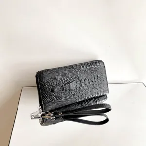 Portefeuille long pour homme en cuir texturé crocodile noir avec dragonne et grande capacité.