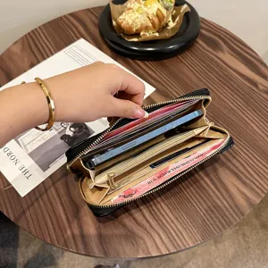 Schwarze lange Reißverschlussbörse für Damen, große Handytasche mit vielen Kartenfächern.