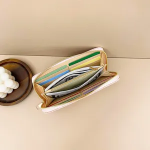 Monedero largo rosa para mujer con ranuras para tarjetas cremallera gran capacidad diseño elegante.