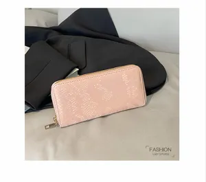 Pink snake print long zip wallet for women, fashionable PU leather clutch purse with cards.