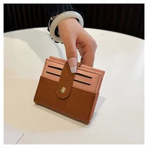 Portafoglio mini bicolore da donna e porta carte compatto con chiusura a pressione.
