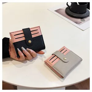 Portafoglio corto donna minimalista porta carte rosa e nero con chiusura a pressione dettaglio
