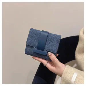 Compact blue denim wallet with dark blue strap closure, stylish short purse for daily casual use.