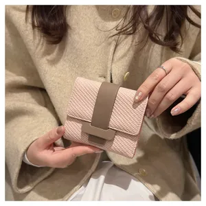 Stylish women's trifold woven wallet with secure snap closure, pink and brown compact design.