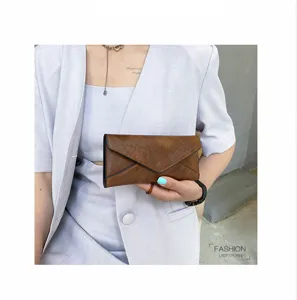 Retro PU leather long wallet for women, elegant envelope clutch with large capacity slots.