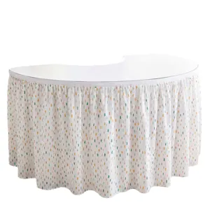 White curved table skirt with colorful polka dot digital print for reception desk party decor.