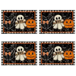 Halloween table placemat detail featuring ghost cat and pumpkin print on linen fabric.