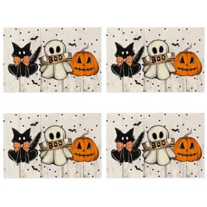 Detailed view of Halloween placemat set featuring cute cat ghost and pumpkin print on linen.