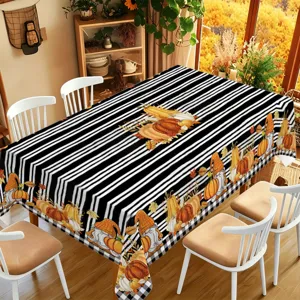 Fall Thanksgiving tablecloth featuring black white stripes, cute pumpkins and autumn gnomes.
