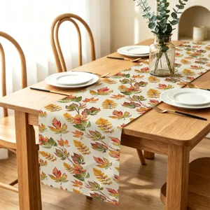 Autumn maple leaf pattern fabric table runner for dining room and home decor setup.