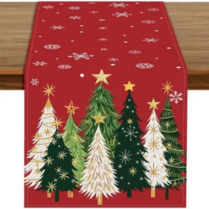 Festive red Christmas table runner with elegant tree prints, perfect for holiday dining decor.