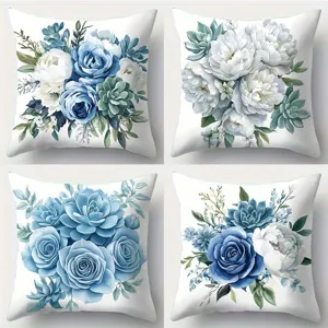 Dekorative blau-weiße Kissenbezüge mit Aquarell-Rosen, Pfingstrosen und Sukkulenten.