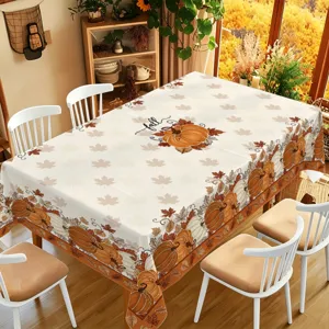 Autumn Thanksgiving pumpkin tablecloth featuring maple leaf prints for dining room decor details.