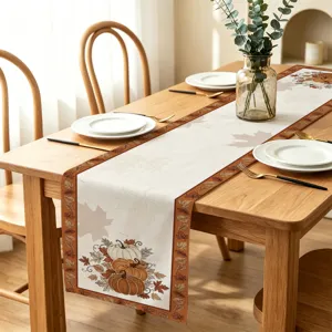 Thanksgiving table runner with pumpkin and maple leaf print for autumn home dining decor.
