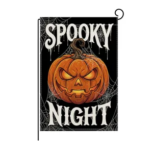 Detail view of Halloween garden flag featuring scary pumpkin and web graphics, vibrant festive decor.