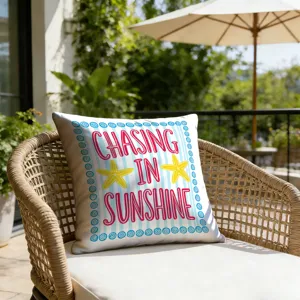 Outdoor resort style throw pillow cover detail, blue stripe starfish print, cozy patio scene.