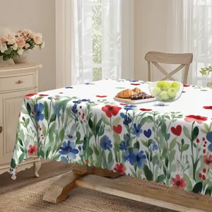 Vista detallada del mantel floral de acuarela rojo y azul con corazones en el comedor acogedor.